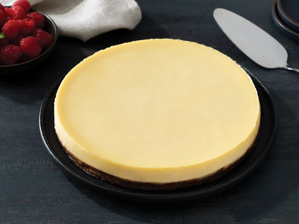 New York style cheesecake served on a dark plate