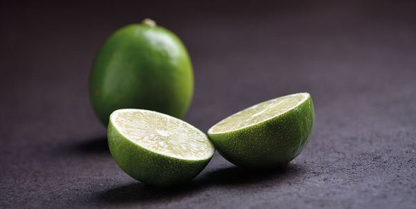 Sliced lime on a contrasting worktop