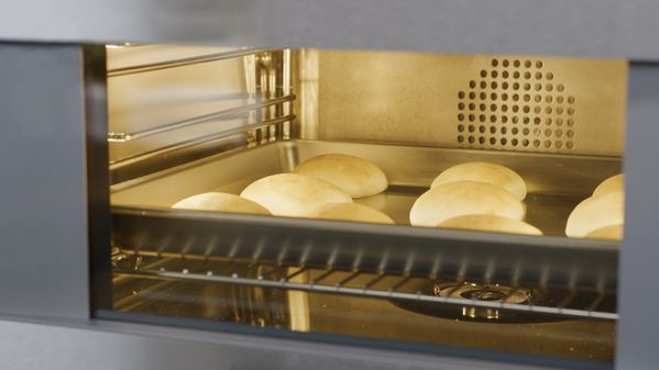 Bread rolls cooking in a Gaggenau steam oven