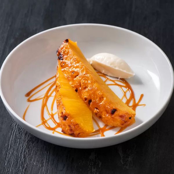 Caramelized pineapple presented in a white bowl
