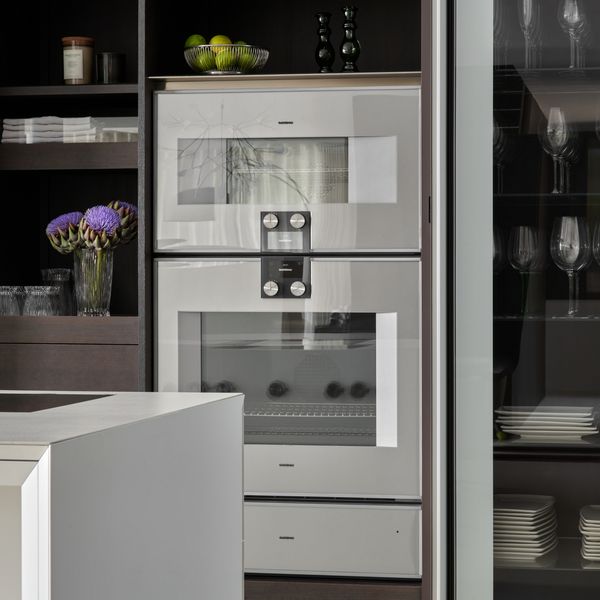 Modern luxury kitchen containing a Gaggenau combo-steam oven and Gaggenau convection oven