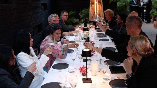 A distinguished group of Gaggenau’s Black Jacket Society chefs making a toast in Val Cantu’s Two MICHELIN Star Californios