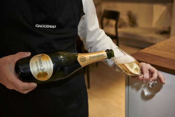 Champagne being poured at the Gaggenau kitchen of the year design contest 2023 awards