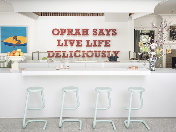 Callahan’s playful statement kitchen juxtaposes the sleek and modern against the more historic adjacent rooms. Photography by Jon Day. 