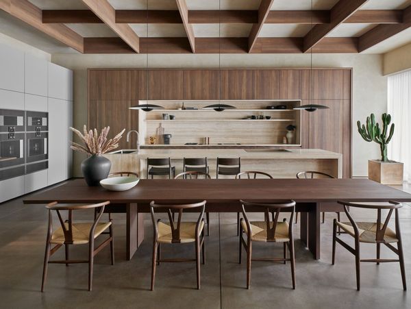 The Houston showroom's main kitchen, featuring gorgeous earth tones and a large wooden dining table that welcomes guests. 