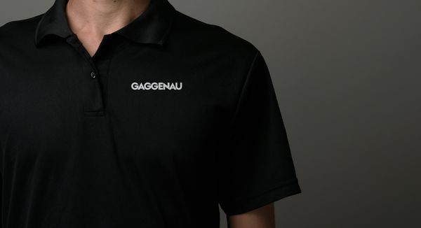Close-up of man wearing a Gaggenau branded polo shirt