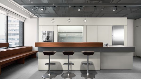 Three stools at a countertop in the Gaggenau New York Flagship showroom