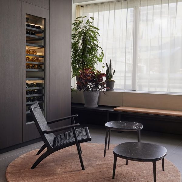 A Gaggenau wine climate cabinet behind a rest area in the New York Flagship showroom