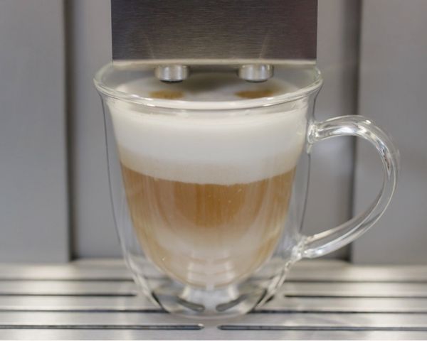 An Espresso in a cup sitting within the Espresso System