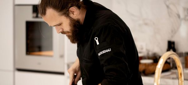 A Chef in a Gaggenau kitchen preparing a dish