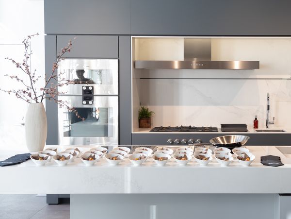 The Chicago showroom's bright interior, with plates arranged carefully on the counter for guests. 