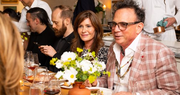 Guests at the table having warm conversation.