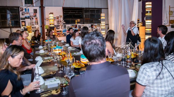 Guests sat at the table, listening to Chef Minh describe the evening's dishes.