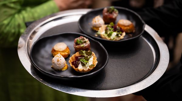 A platter of artfully arranged canapés. 