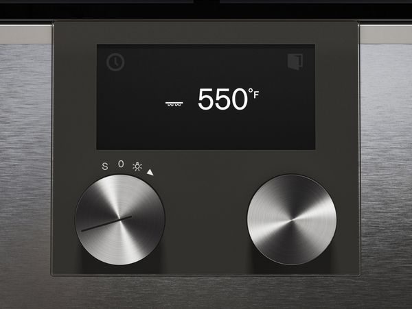 Close-up of Gaggenau convection oven TFT display in baking stone mode set at 550 degrees Fahrenheit 