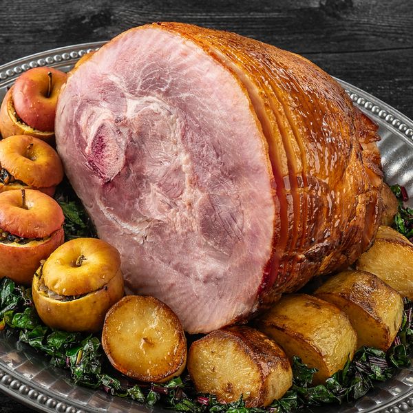 Close-up of a Baked Ham with Apple Cider Maple Glaze on an ornate platter 