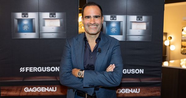 Dr. Langer poses for the camera in front of a Gaggenau and Ferguson backdrop. 