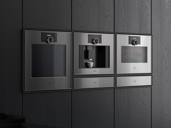 The Gaggenau Expressive series fully automatic espresso machine installed between other complimentary series appliances