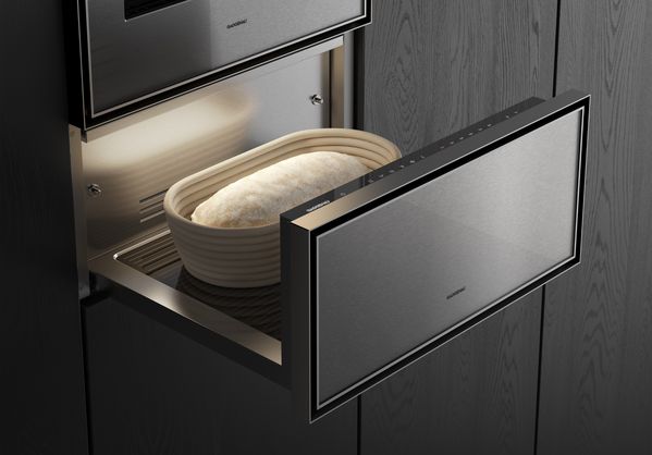 Close-up of an open Gaggenau Expressive series culinary warming drawer