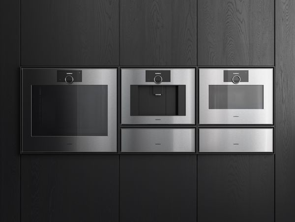 Gaggenau Expressive Series appliances fitted in a dark wood interior