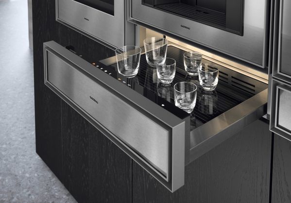 Close-up of an open Gaggenau Expressive series culinary warming drawer