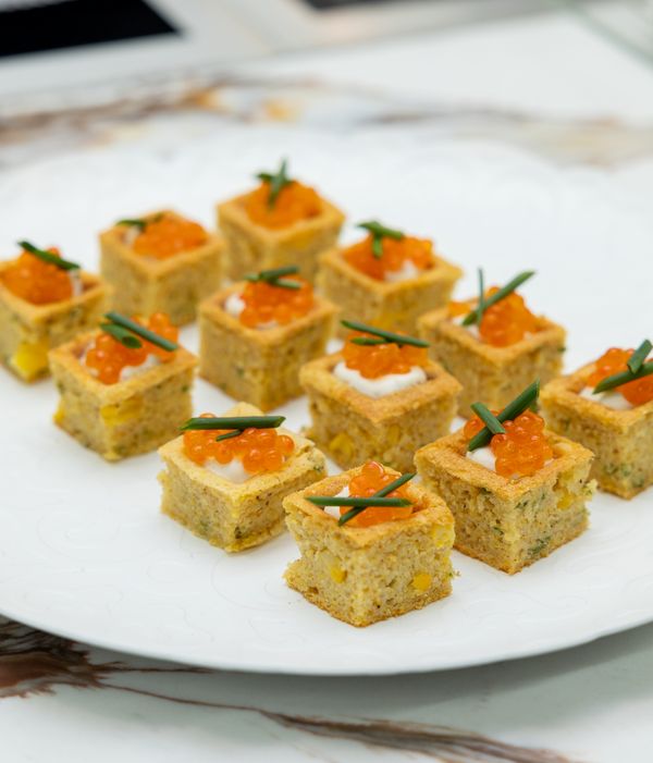 A close-up shot of Chef Paul Tang's savory corn waffle bites. 