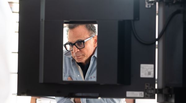 Chef Josiah Citrin inspects the Gaggenau Expressive Series Fully Automatic Coffee Machine.