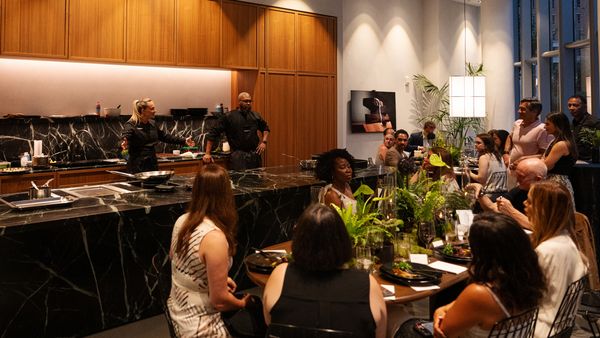 Chef Stella Giraldella and her staff address guests in the lavish interior of the Gaggenau DC showroom.