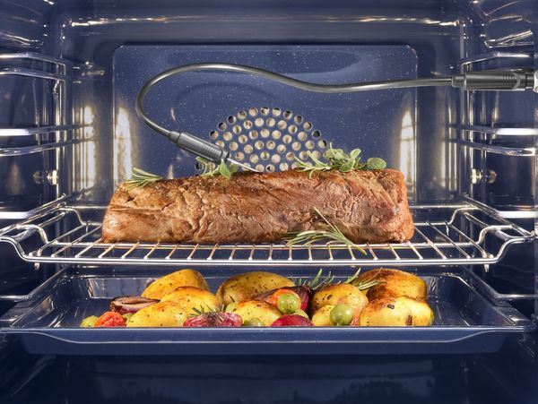 A Gaggenau convection oven and temperature probe being used to cook a perfect roast dinner