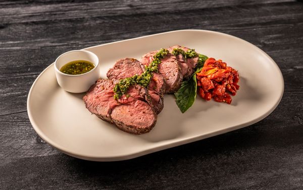 A dish containing Slow Roasted Beef Fillet and Tomatoes