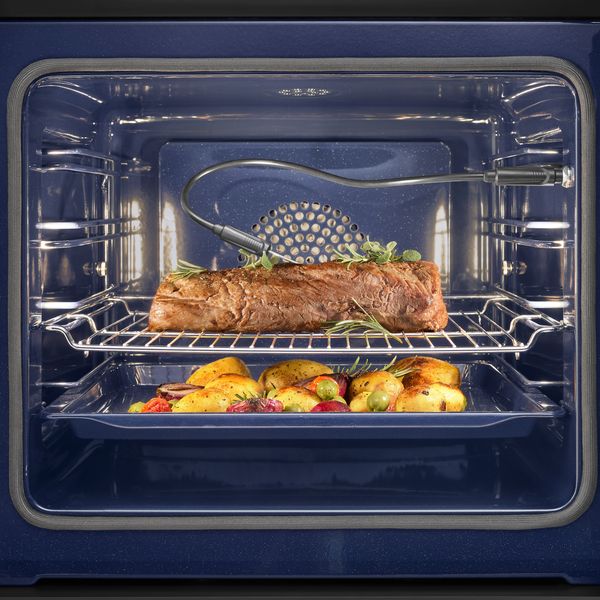 A Gaggenau convection oven and temperature probe being used to cook a perfect roast dinner