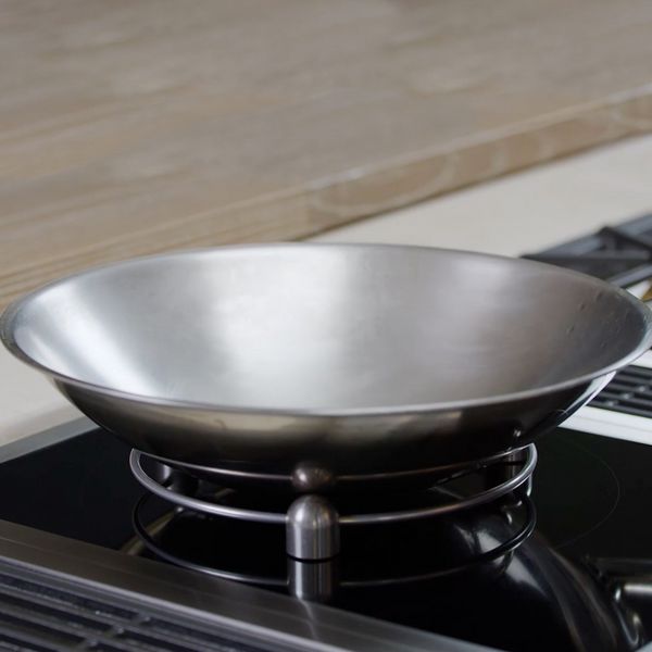 Close-up of a Gaggenau 400 series Vario induction cooktop, wok ring and wok pan