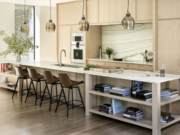 Lit beautifully by natural light from large windows, Sam Fertik's home kitchen is open and welcoming. 