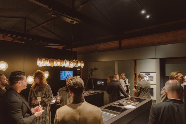 Attendees socializing amidst a stylish interior
