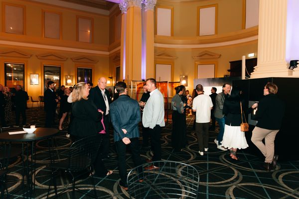 Guests engaging in conversation, showcasing the Gaggenau display area.