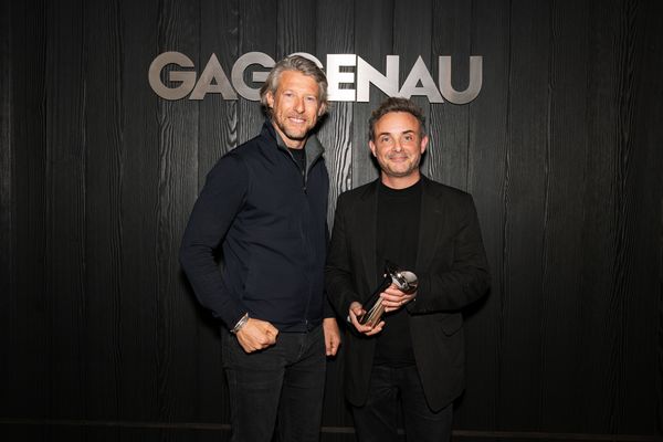 Winners ‘The Best of the Best’ Award holding a trophy, posing in front of a Gaggenau sign.