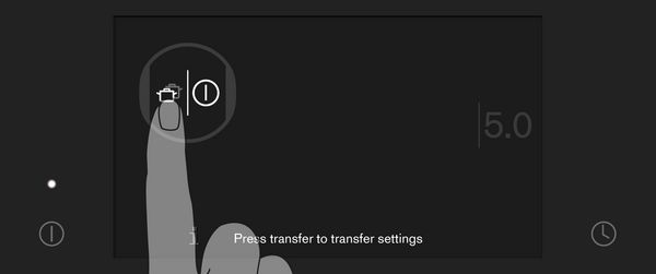 Close-up of Gaggenau full surface induction cooktop touch screen showing the Transfer symbol