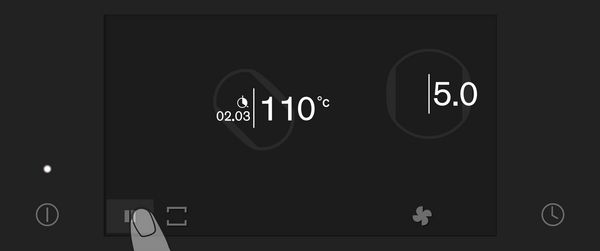 Close-up of Gaggenau full surface induction cooktop touch screen showing the Pause function