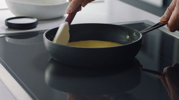 Close-up of a Chef using the Gaggenau full surface induction cooktop 