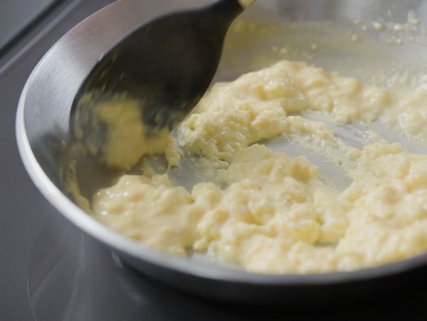 Close-up of a chef using the Gaggenau full surface induction cooktop 