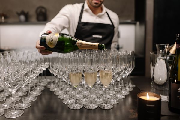 A sommelier pouring red wine at the Gaggenau Sydney launch event.