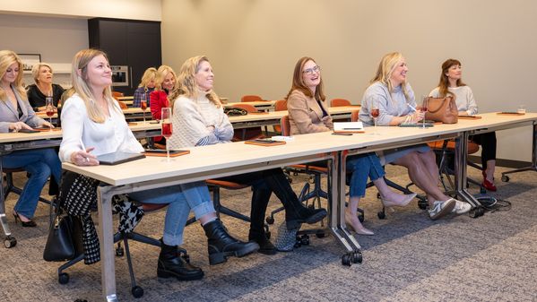 Attendees listening to speakers Laura Umansky and Melissa Grove of DesignDash.