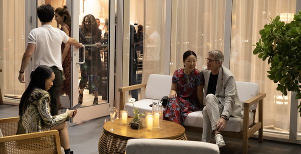 Guests enjoying the evening air and stunning Miami skyline from the Gaggenau showroom&rsquo;s outdoor patio space.
