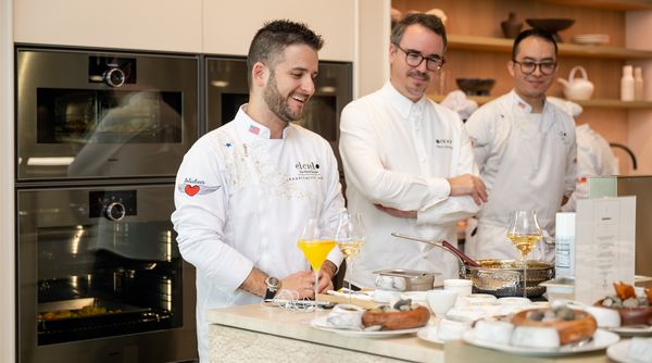 Chefs Juan Manuel Barrientos and Paco Morales address the crowd.