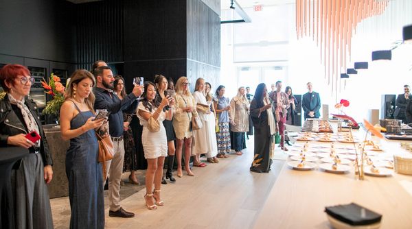 Guests listening to the chefs discuss their creations.