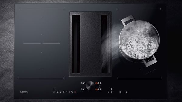 Gaggenau 200 series flex induction cooktop with built in downdraft ventilation in action