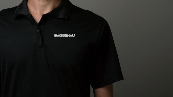 Close-up of man wearing a Gaggenau branded polo shirt 
