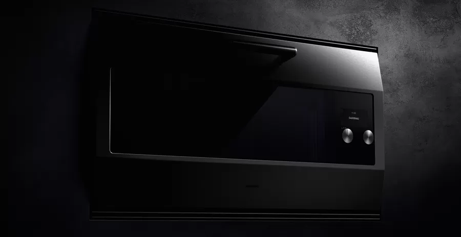 The Gaggenau EB 333 oven in spotlight showing its 90cm stainless steel front